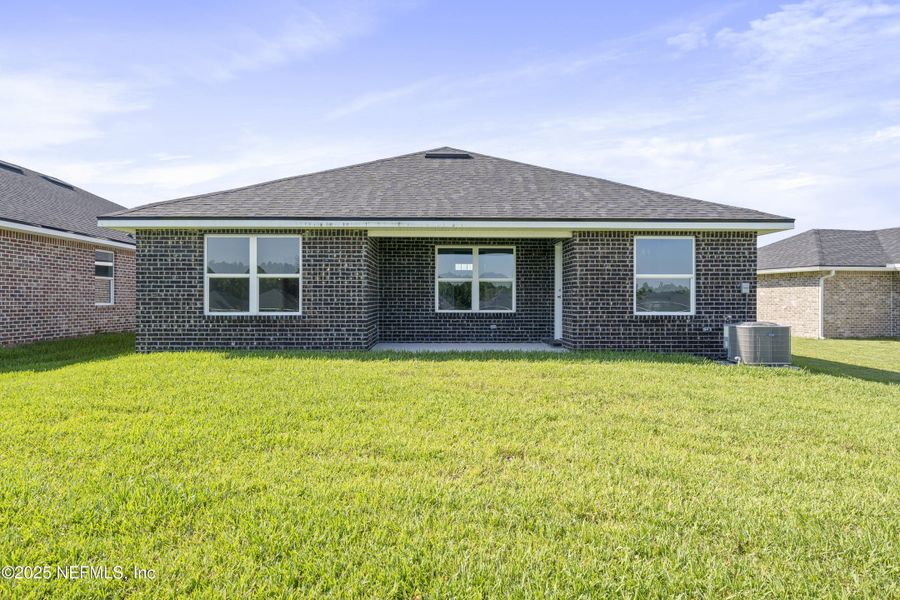 Front exterior of a new home in Shadow Crest at Rolling Hills, Green Cove Springs, FL, highlighting curb appeal (Image 14).