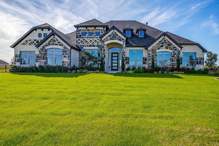Front exterior of a new home in Heritage, McLendon-Chisholm, TX, highlighting curb appeal (Image 22).