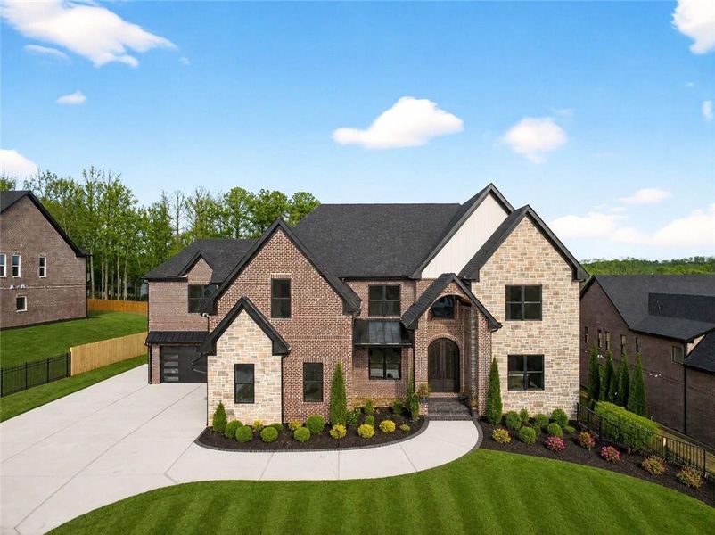 Front exterior of a new home in , Buford, GA, highlighting curb appeal (Image 31). Front exterior of a new home in , Buford, GA, highlighting curb appeal (Image 31).