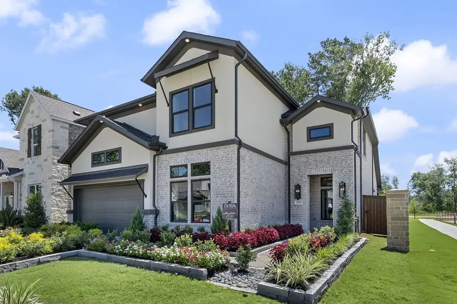 Front exterior of a new home in The Highlands 50', Porter, TX, highlighting curb appeal (Image 2).