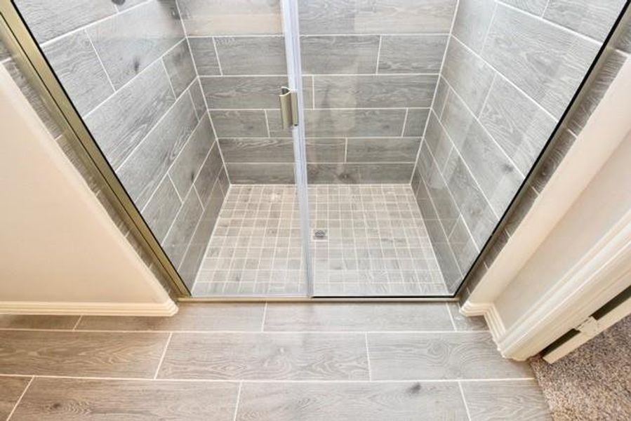 Primary bathroom with a shower stall