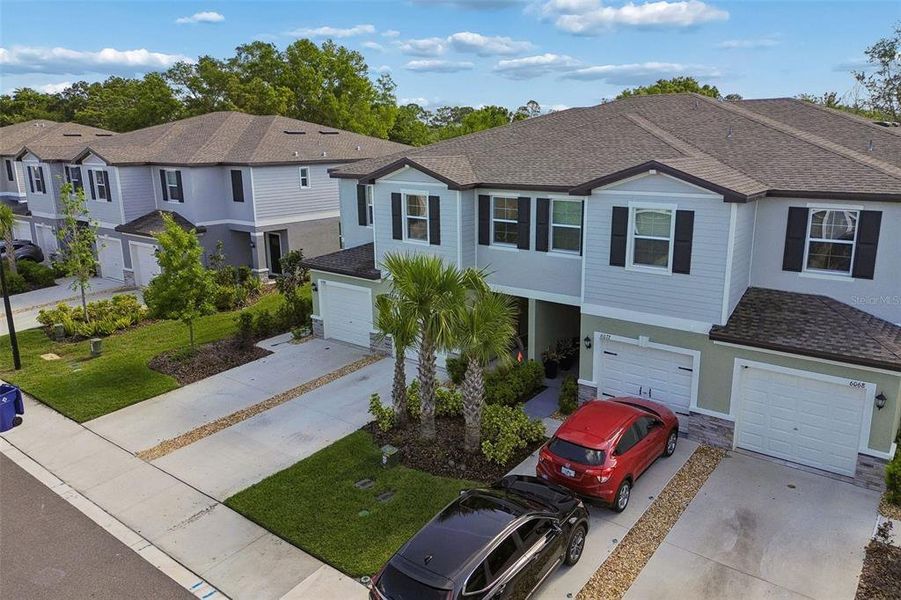 Front exterior of a new home in , Land O' Lakes, FL, highlighting curb appeal (Image 25).