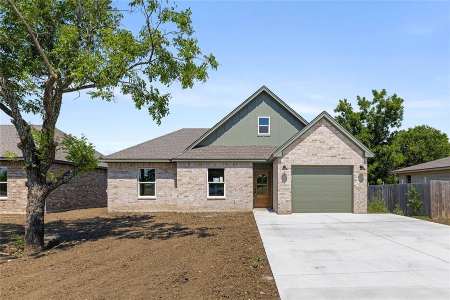 Front exterior of a new home in , McGregor, TX, highlighting curb appeal (Image 1).
