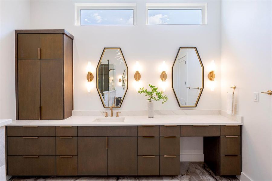 Bathroom featuring vanity and plenty of natural light