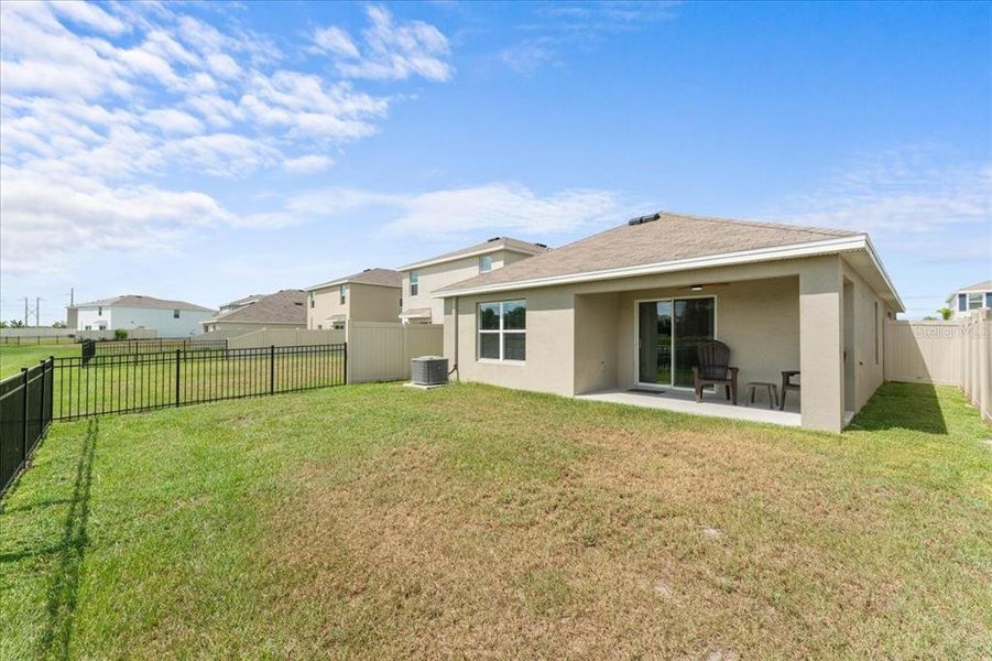 Exterior details and patio area of a home in Bella Lago, Parrish (Image 3).