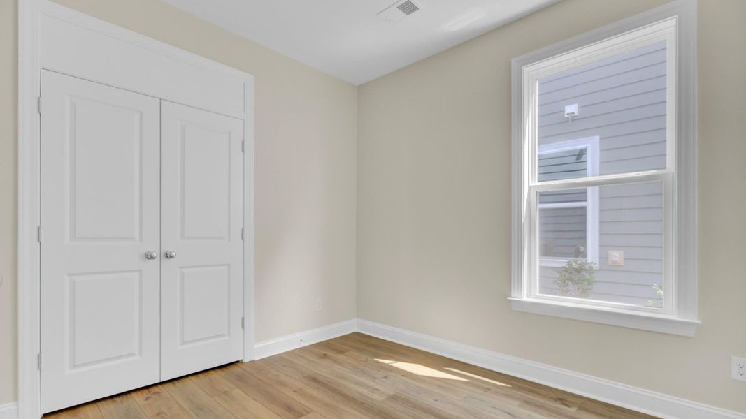 Spacious, unfurnished interior of a new home in Cresswind Charleston, Summerville (Image 23).