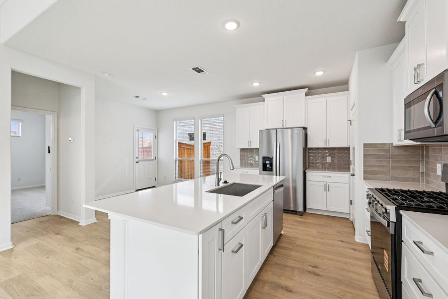 Furnished interior view inside a new home in Crosswinds, Kyle (Image 4).
