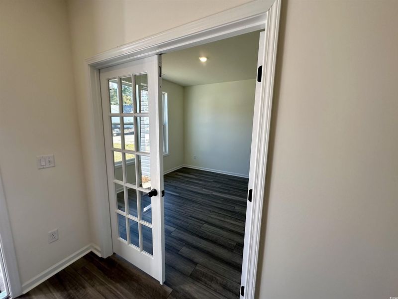 Home Office with french doors with wood finished floors and baseboards Home Office with french doors with wood finished floors and baseboards