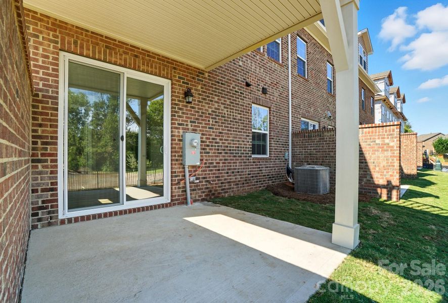 representation of covered porch - actual home has different brick color