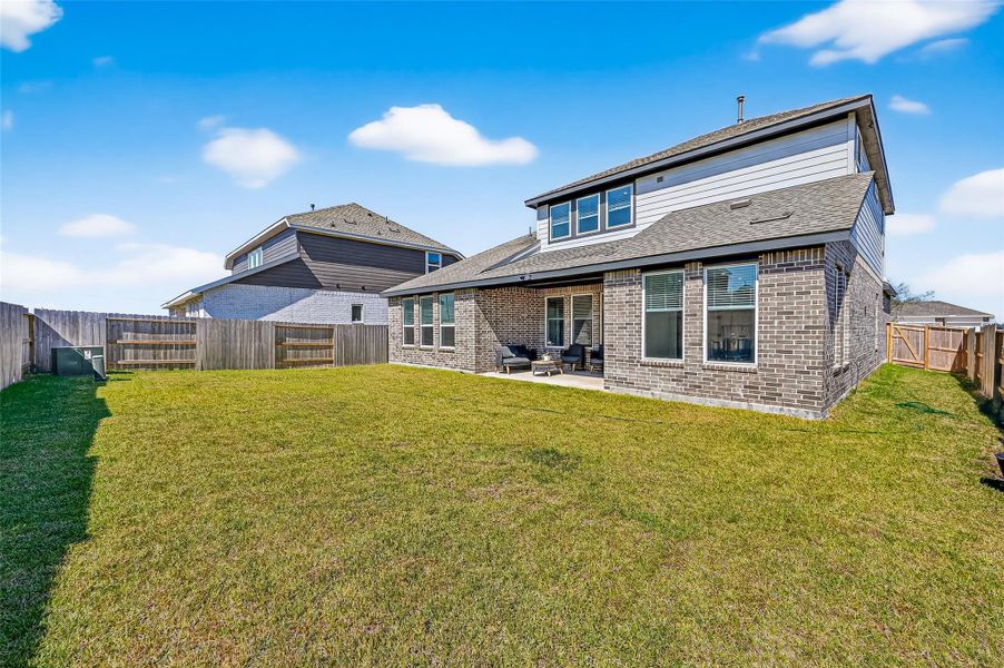 Expansive backyard perfect for relaxation and entertainment. Expansive backyard perfect for relaxation and entertainment.