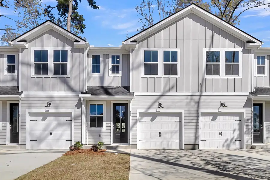 Front exterior of a new home in Windward Village, Summerville, SC, highlighting curb appeal (Image 1). Front exterior of a new home in Windward Village, Summerville, SC, highlighting curb appeal (Image 1).