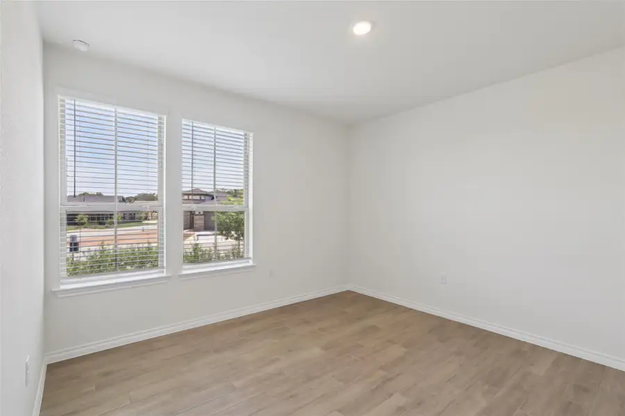Spare room with light wood-style flooring and recessed lighting