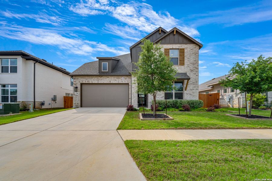 Front exterior of a new home in Meyer Ranch, New Braunfels, TX, highlighting curb appeal (Image 21).