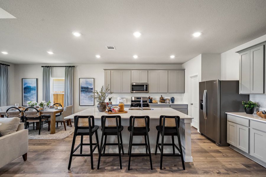 A kitchen with a dining table.