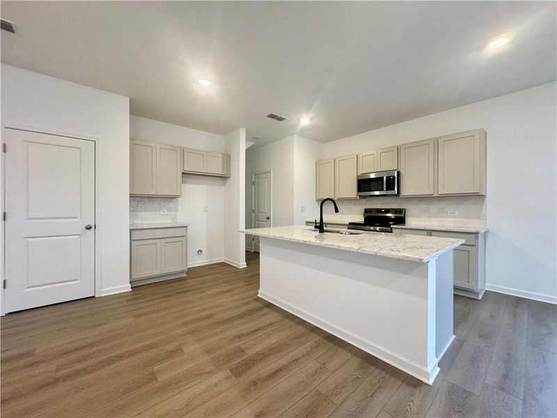 Furnished interior view inside a new home in Eastlyn Crossing, Flowery Branch (Image 7).