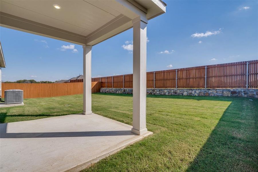 Exterior details and patio area of a home in Heartland Signature, Crandall (Image 14). Exterior details and patio area of a home in Heartland Signature, Crandall (Image 14).