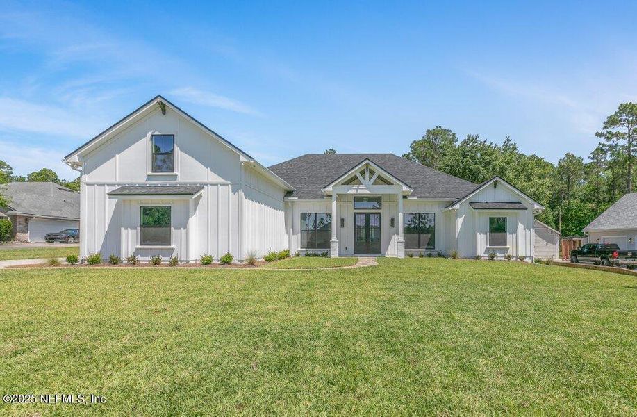 Front exterior of a new home in , Jacksonville, FL, highlighting curb appeal (Image 25).