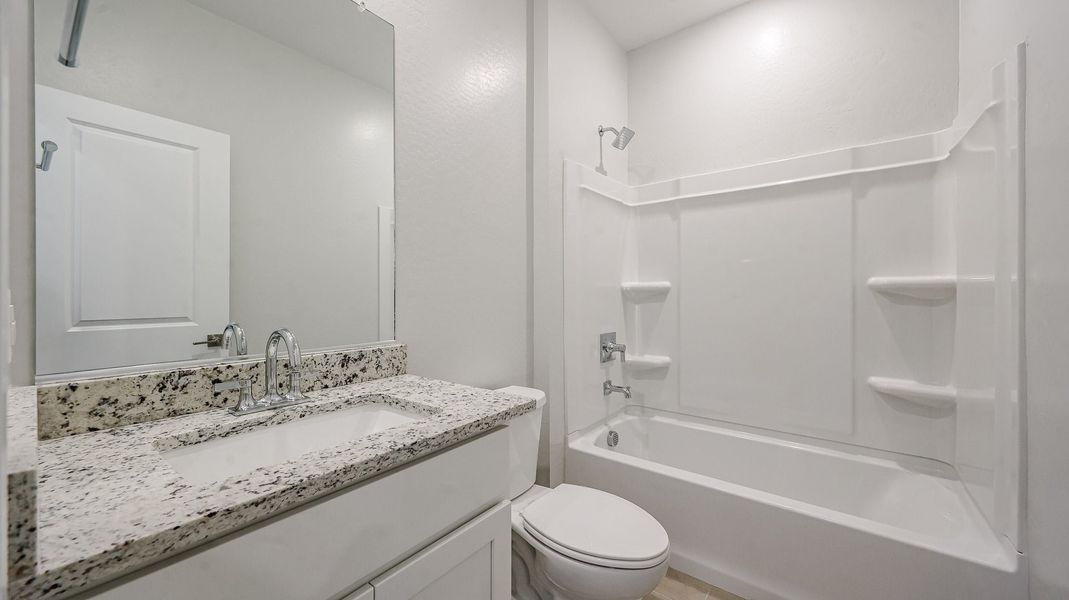A bathroom with a marble countertop. A bathroom with a marble countertop.