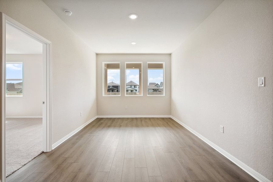 Representative unfurnished interior of a home built from the Blake by Ashton Woods in Rolling Glen, Hutto (Image 21).