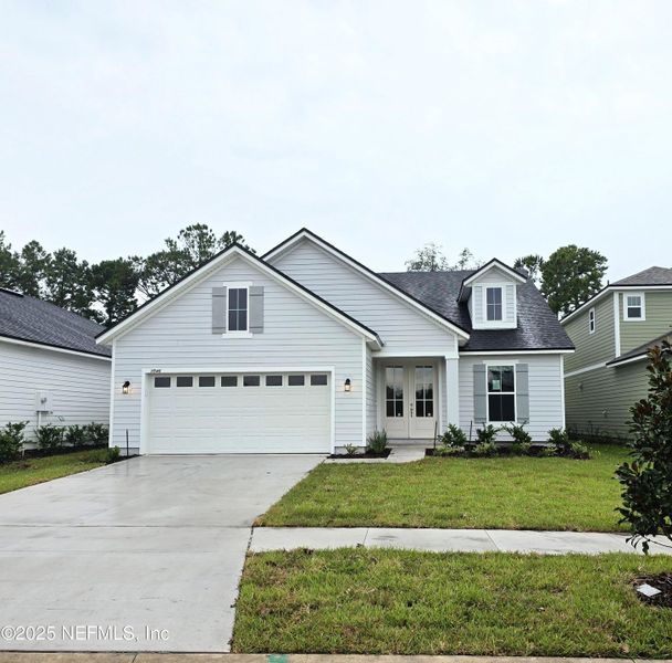 Front exterior of a new home in Hyland Trail, Green Cove Springs, FL, highlighting curb appeal (Image 1). Front exterior of a new home in Hyland Trail, Green Cove Springs, FL, highlighting curb appeal (Image 1).