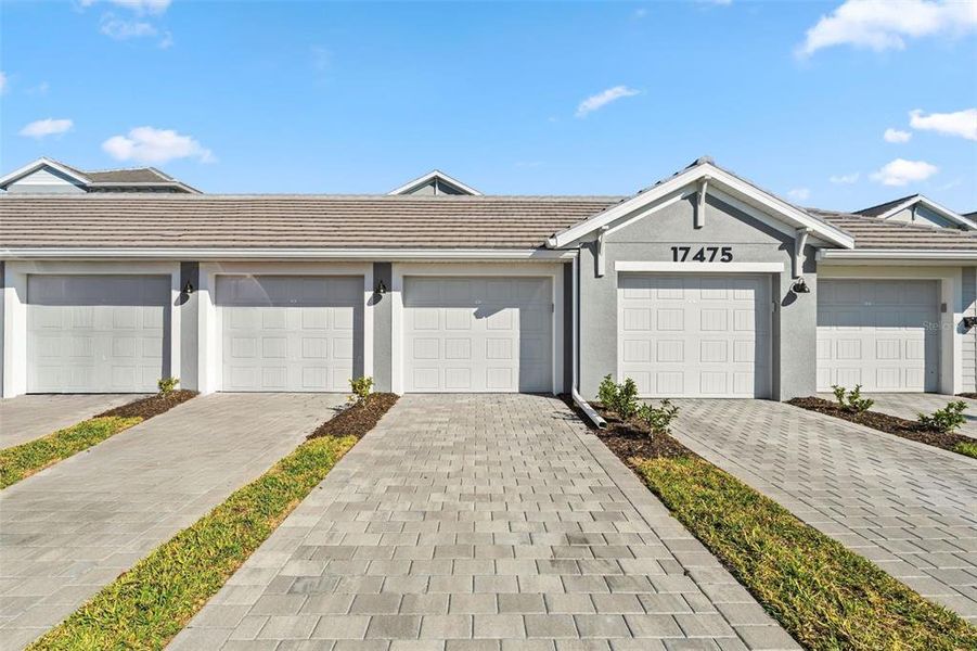 Front exterior of a new home in , Venice, FL, highlighting curb appeal (Image 1).