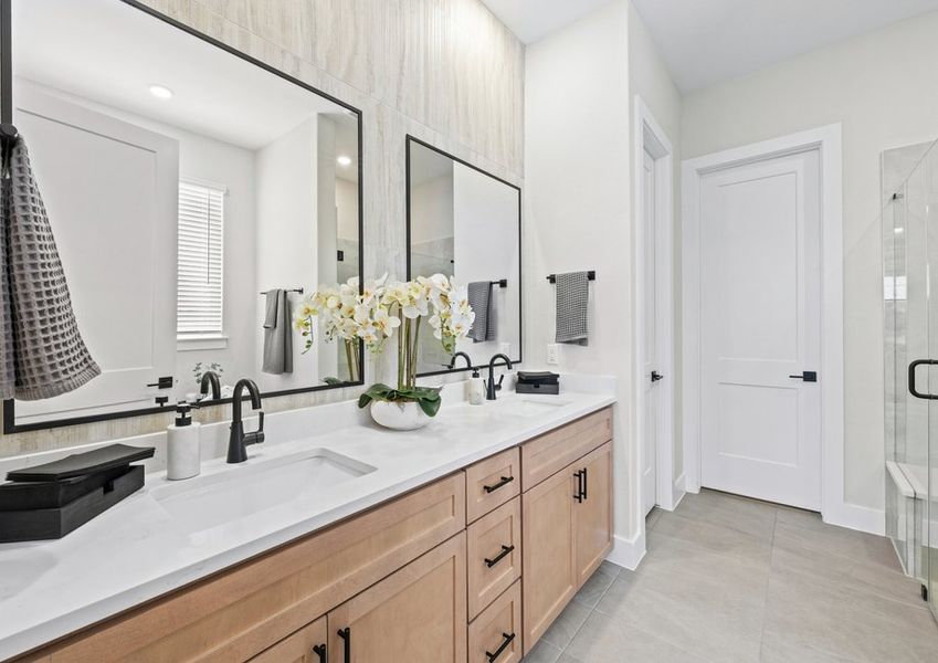 The master bathroom has a sprawling dual-sink vanity.