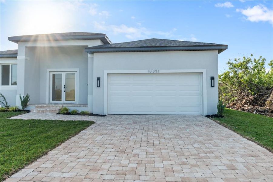 Front exterior of a new home in , Port Charlotte, FL, highlighting curb appeal (Image 13).