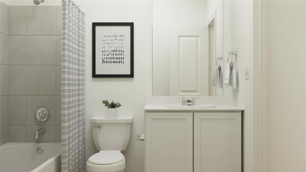 Full bathroom featuring shower / tub combo with curtain, vanity, and toilet