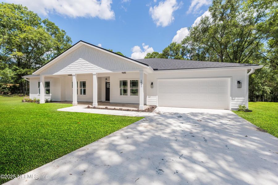 Front exterior of a new home in , Middleburg, FL, highlighting curb appeal (Image 2). Front exterior of a new home in , Middleburg, FL, highlighting curb appeal (Image 2).