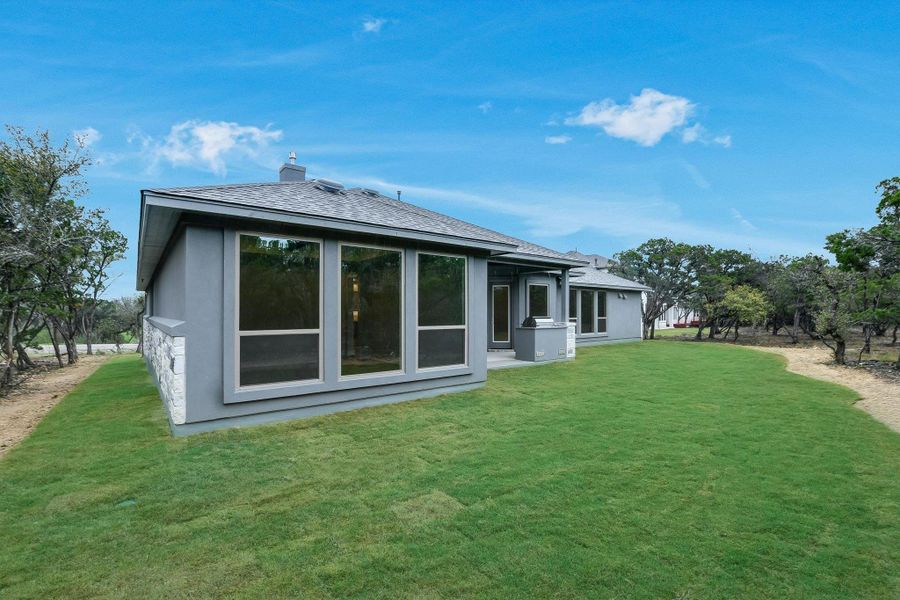 Exterior details and patio area of a home in The Hollows on Lake Travis, Leander (Image 24).