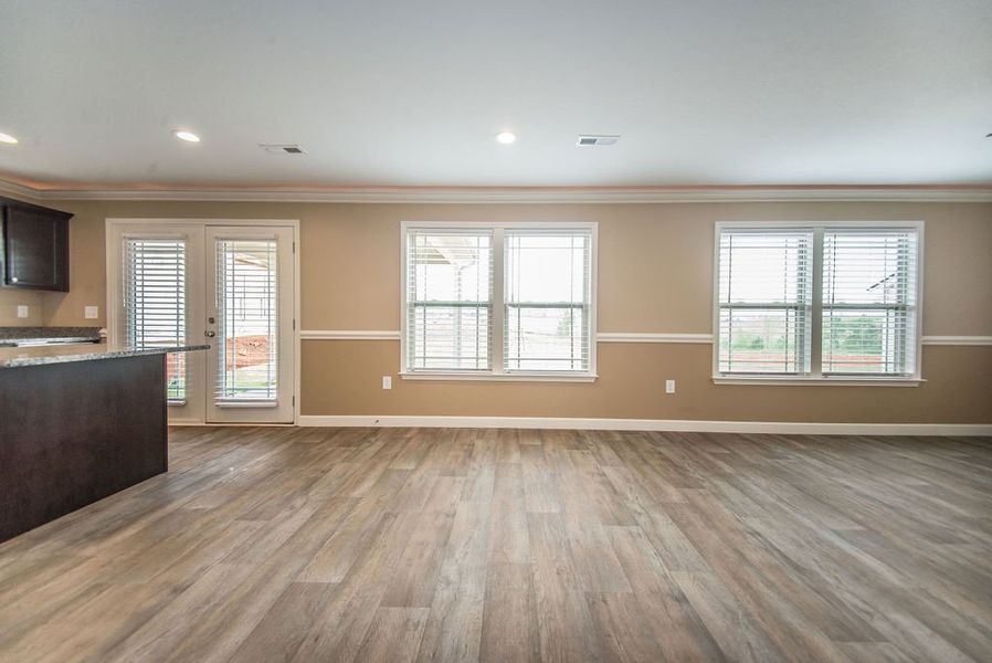 Representative unfurnished interior of a home built from the Reynolds by Enchanted Homes in Hampshire Heights, Moore (Image 30).