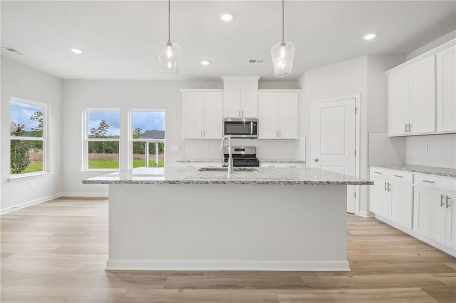 Furnished interior view inside a new home in Northwoods at Mirror Lake, Villa Rica (Image 6).