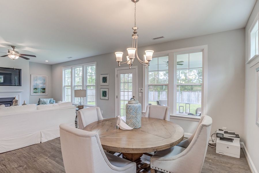Representative furnished interior of a home built from the The Amherst by RobuckHomes in Windwater, Hampstead (Image 13).