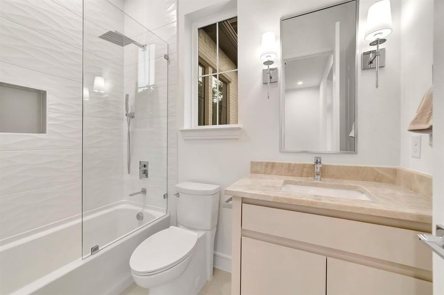 Full bathroom featuring vanity and bathtub / shower combination Full bathroom featuring vanity and bathtub / shower combination