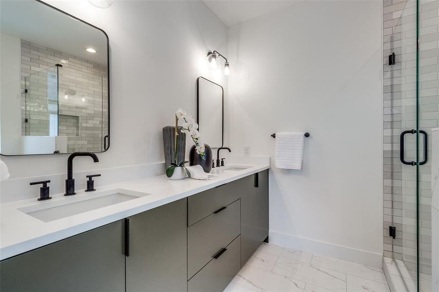 Bathroom featuring walk in shower and vanity