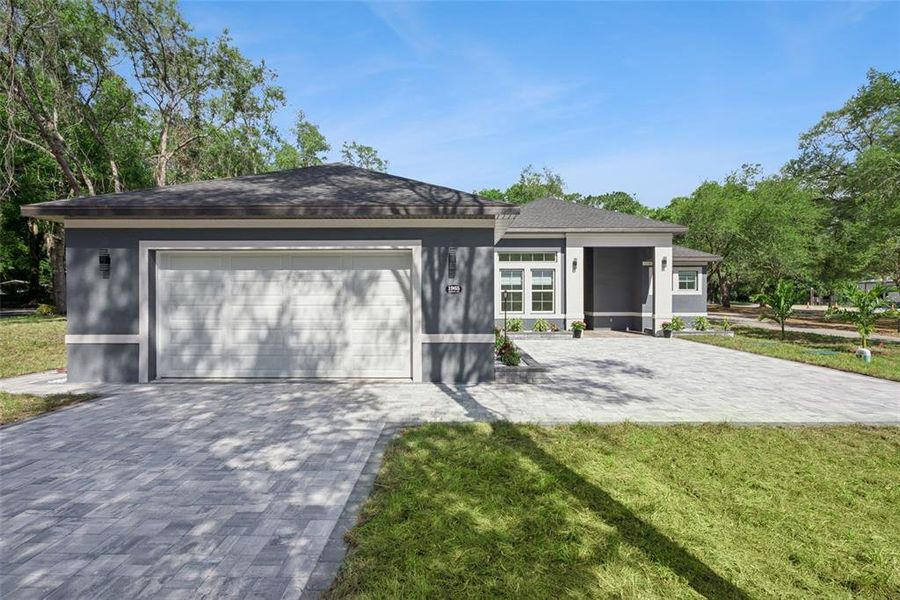 Front exterior of a new home in , Apopka, FL, highlighting curb appeal (Image 25).