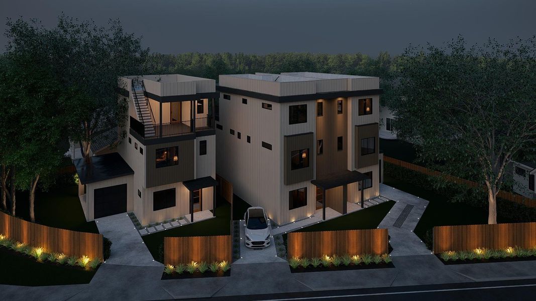 View of front of property featuring a balcony and driveway