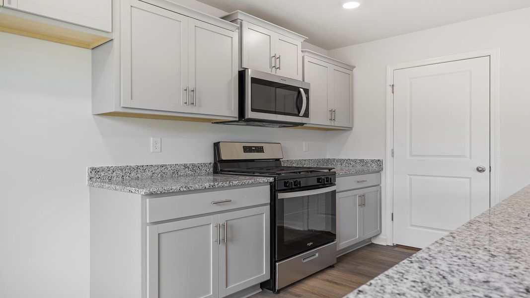 Furnished interior view inside a new home in Bentley Park, Greenwood (Image 8).