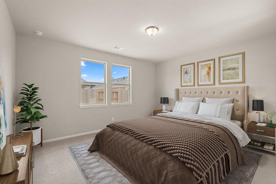 The primary bedroom is generously sized, creating a tranquil and spacious retreat that offers ample room for relaxation. Featuring plush carpet, high ceilings, fresh paint, and large windows that lets in natural lighting throughout the day.