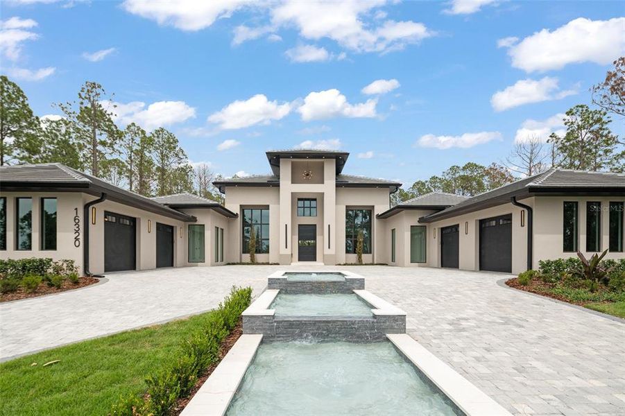 Front exterior of a new home in , Montverde, FL, highlighting curb appeal (Image 38).
