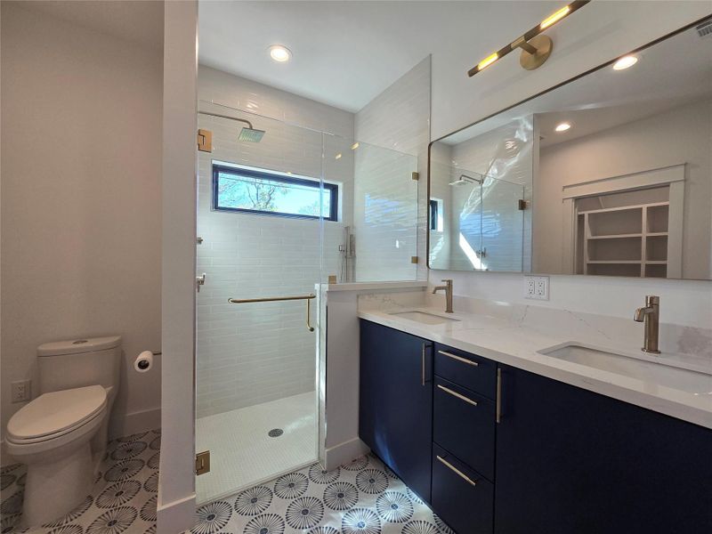 Main bathroom with a curbless shower (nothing to step and trip over!), dual sink vanity and a toilet with an electric plug next to it (for a future easy installation of a bidet - heated seat/water/fan) Main bathroom with a curbless shower (nothing to step and trip over!), dual sink vanity and a toilet with an electric plug next to it (for a future easy installation of a bidet - heated seat/water/fan)