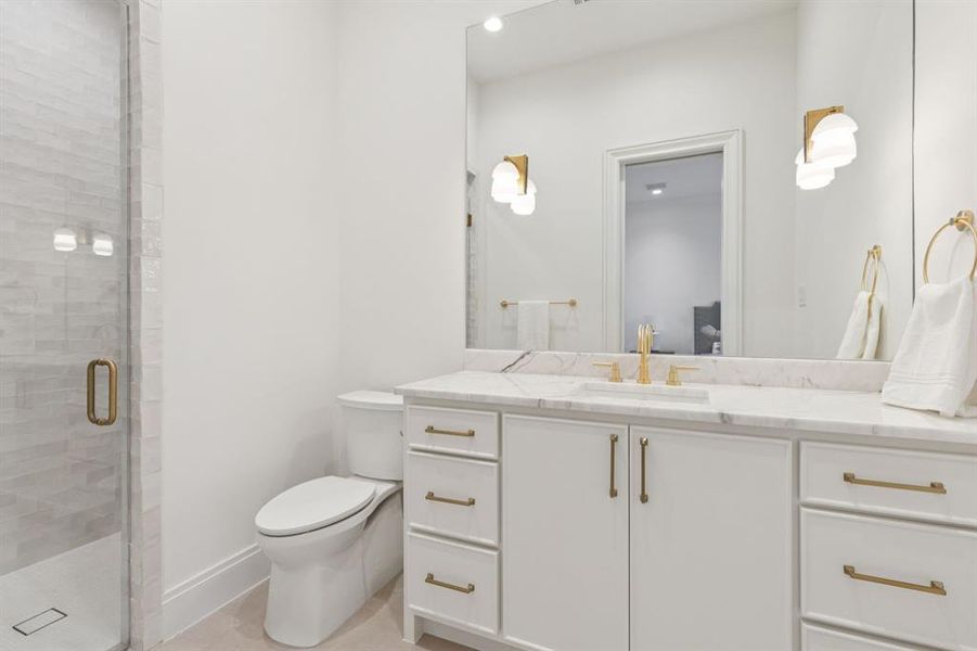 Bathroom with vanity and a shower stall