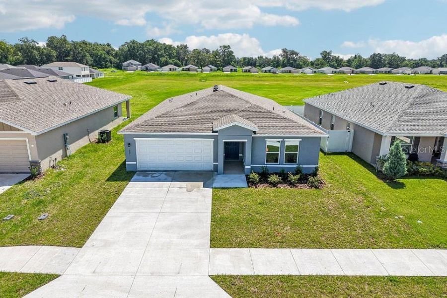 Front exterior of a new home in Bennah Oaks, Belleview, FL, highlighting curb appeal (Image 2). Front exterior of a new home in Bennah Oaks, Belleview, FL, highlighting curb appeal (Image 2).