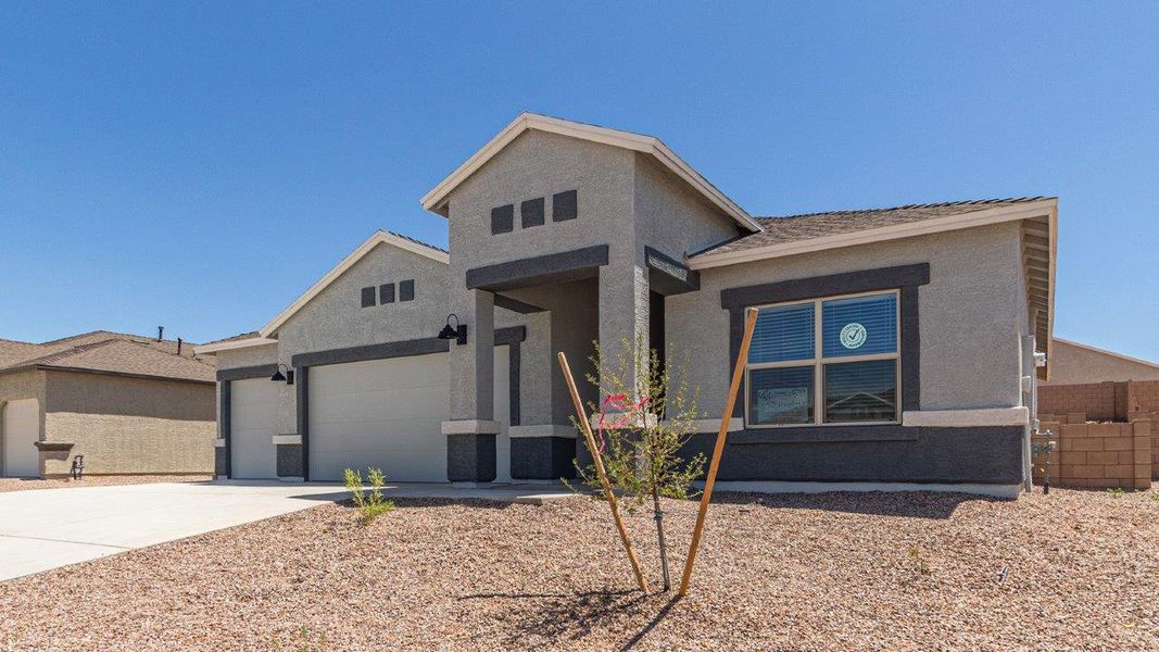 Front exterior of a new home in Sycamore Vista, Vail, AZ, highlighting curb appeal (Image 19).