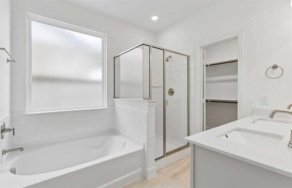 Owners bath with separate tub and shower