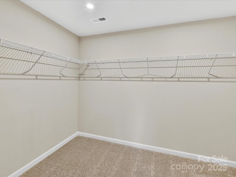 Primary Walk-In Closet. Primary Walk-In Closet.