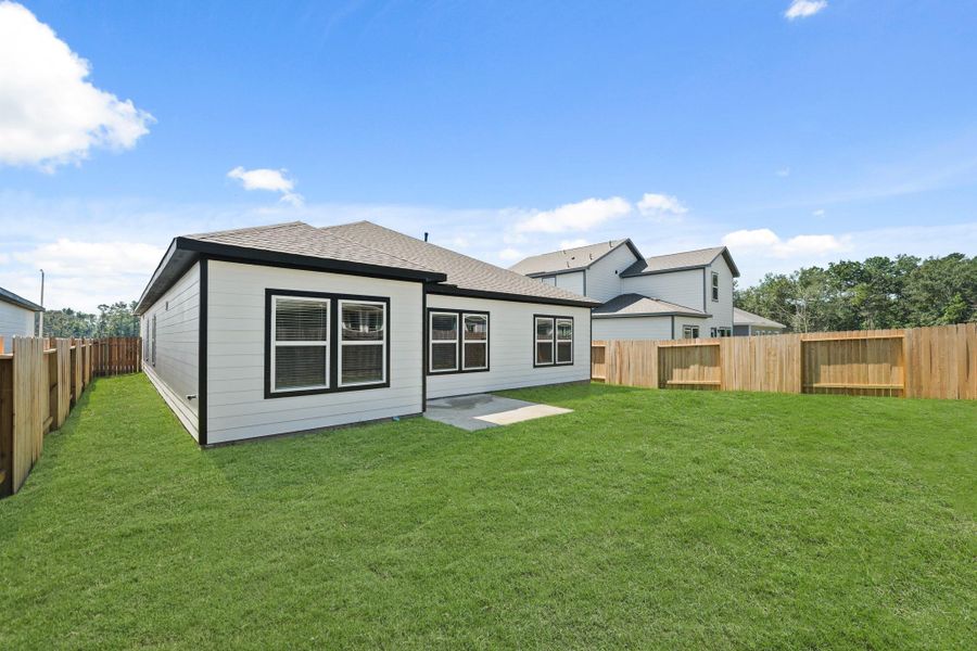 Front exterior of a new home in Caney Mills, Conroe, TX, highlighting curb appeal (Image 21).