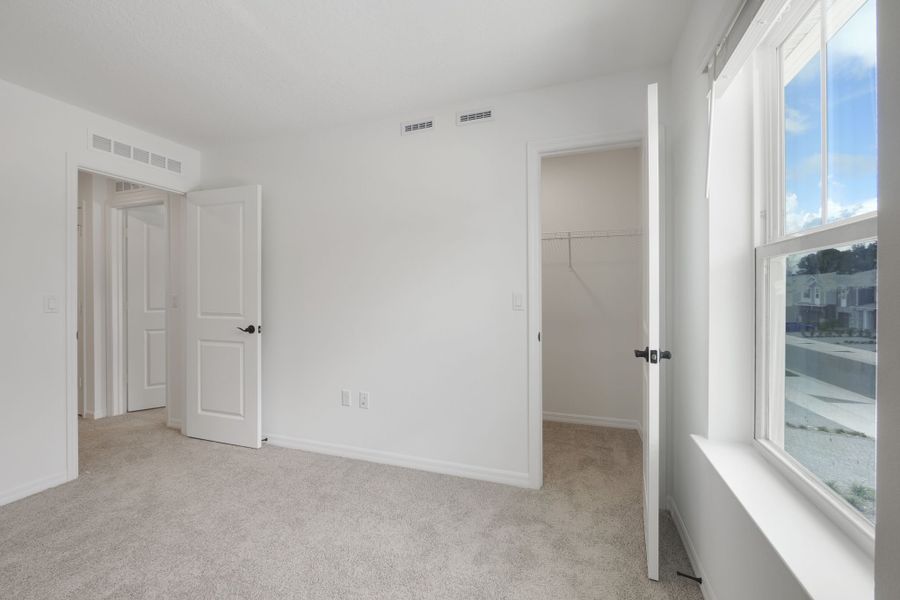 Spacious, unfurnished interior of a new home in Towns at Riverwalk, Sanford (Image 22).