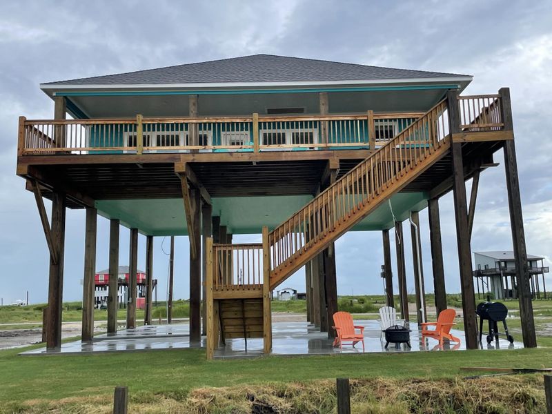 Front exterior of a new home in , Bolivar Peninsula, TX, highlighting curb appeal (Image 1). Front exterior of a new home in , Bolivar Peninsula, TX, highlighting curb appeal (Image 1).