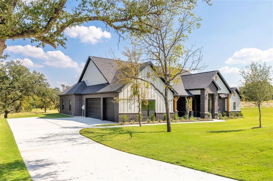 Front exterior of a new home in Vintage Oaks, Weatherford, TX, highlighting curb appeal (Image 23). Front exterior of a new home in Vintage Oaks, Weatherford, TX, highlighting curb appeal (Image 23).